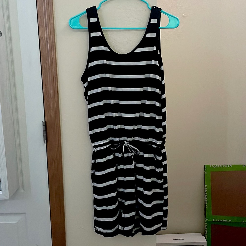 Black and white striped romper with tie at the waist.